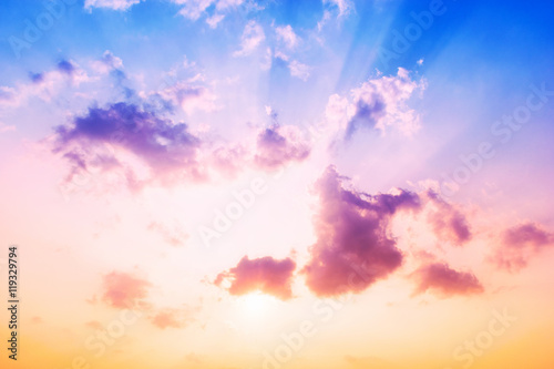 Background sky Sunset,Sky blue and orange light of the sun through the clouds in the sky survive.(Sky and clouds with different colors.)