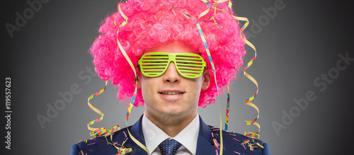 Funny businessman in pink wig