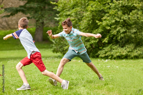 happy kids running and playing game outdoors