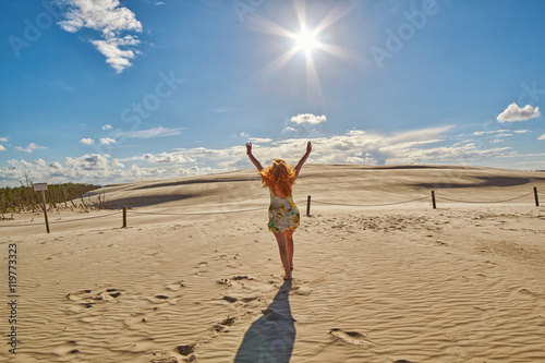 Happy Woman against Sand Dunes in Leba, Poland