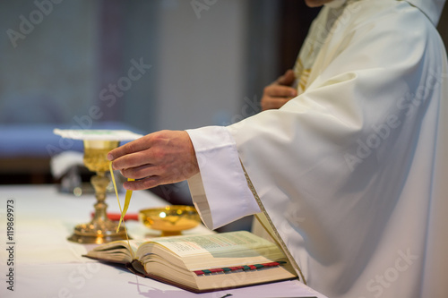 Priest during a wedding ceremony/nuptial mass (shallow DOF; colo