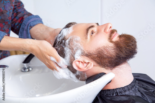 man having his hair washed in a hairdressing salon