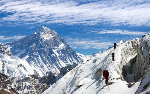 view of Everest and Lhotse with group of climbers