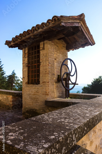 Old covered well in masonry