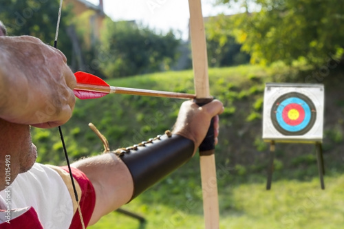 Medieval archer shoot at a target