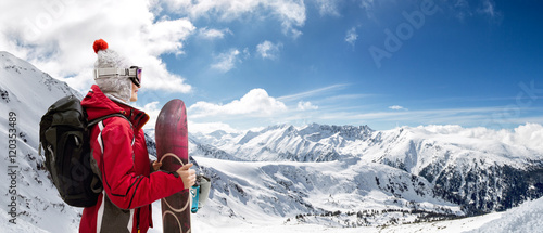 Girl standing with snowboard