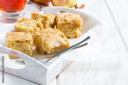 Homemade blondie brownies apple cake, square slices, copy space