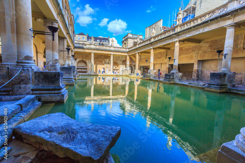 BATH, ENGLAND - JULY 8, 2014: inside of Roman Baths with unidentified people, which is a site of historical interest in the city of Bath. The house is a well-preserved Roman site for public bathing.