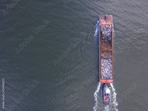 Aerial image of a garbage barge in the river