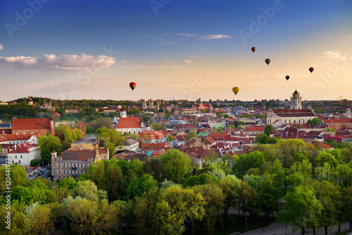 Beautiful panorama of Vilnius old town with hot air balloons in the sky