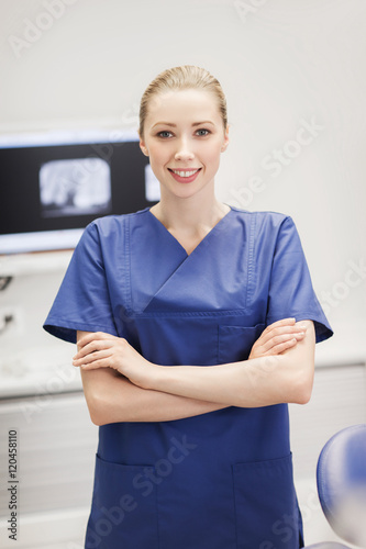 happy female dentist at dental clinic office