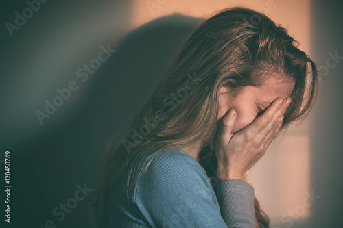 A woman sitting alone and depressed