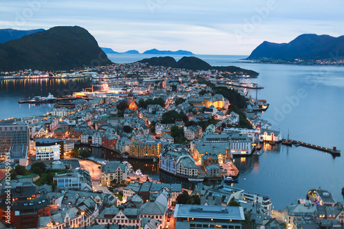 Beautiful super wide-angle summer aerial view of Alesund, Norway, with skyline and scenery beyond the city, seen from the observation deck of Aksla mountain