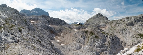 panorama of Triglav, Begunjski vrh with Dom Valentina Stanica mountain hut in Julian Alps in Slovenia