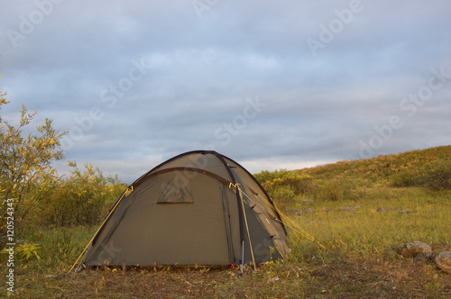 Tourist tent in the tundra. Summer in the Polar Ural Mountains.
