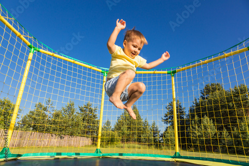 Little boy on a trampoline
