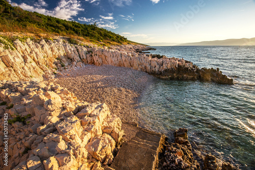 Sunrise over the rocky beach on the coast of Adriatic Sea, Istria, Croatia