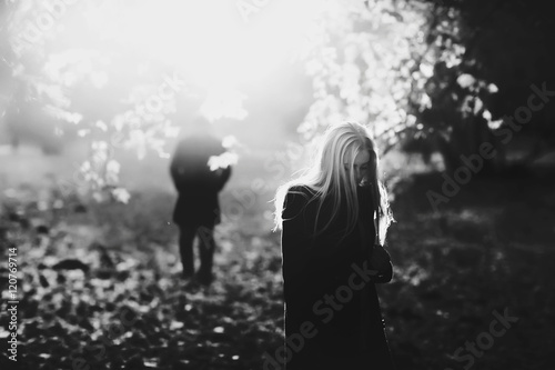 Beautiful young couple in the autumn park