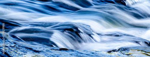 Waterfall into foamy river