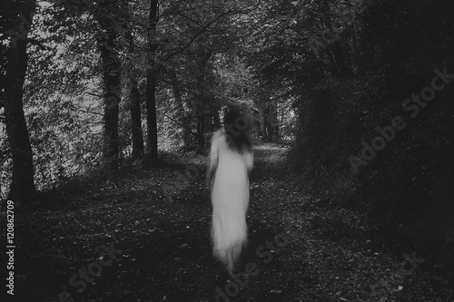 Running woman in the forest