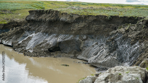 YAMAL PENINSULA, RUSSIA - JUNE 18, 2015: Expedition to the giant funnel of unknown origin. Former crater, which became a lake.