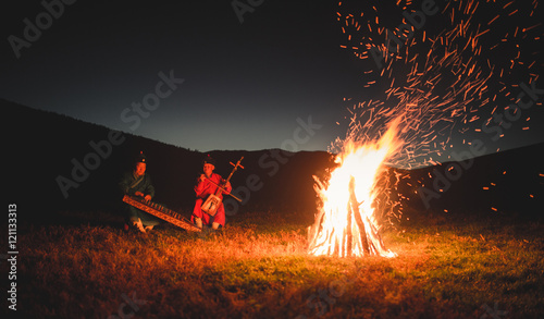 Musicians By The Camp Fire
