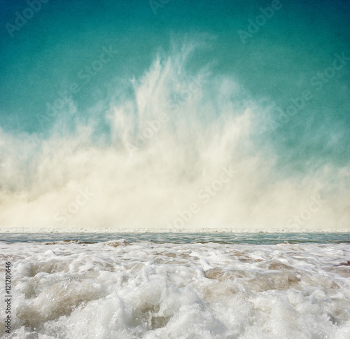 Fog and Surf. Ocean waves with fog rising at the horizon. Image displays a pleasing grain texture at 100 percent.