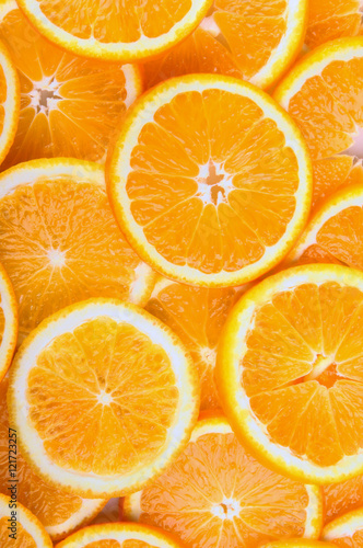 citrus background. juicy slices of orange cover the entire surface