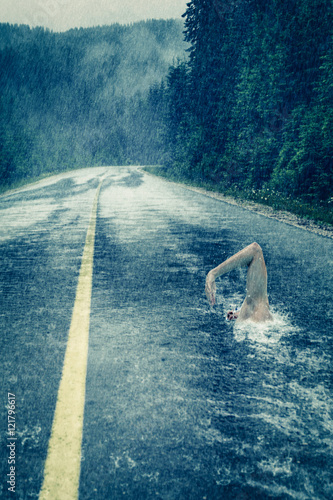 Asphalt swimmer in the rain