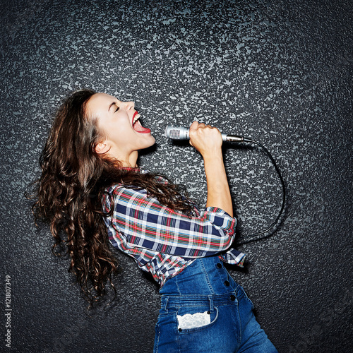 Woman singing with microphone