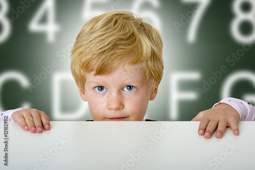 Child looking out over the tabletop
