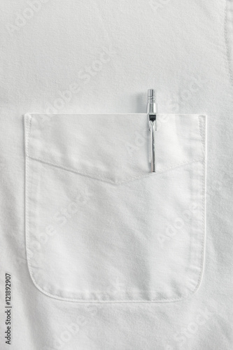 Close up pen in pocket on white shirt