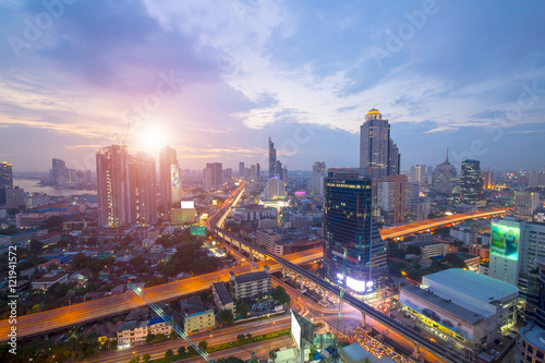 Bangkok Transportation at Dusk with Modern Business Building along the river (Thailand)