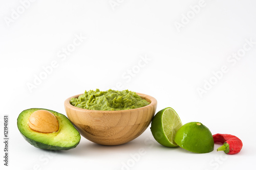 Nachos, guacamole and ingredients isolated on white background