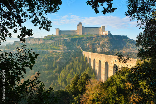 Spoleto (Italy) - A misty fall day in the charming medieval village in Umbria region. The soft focus depends on dense fog, which, however, creates an evocative atmosphere with Sun rays 