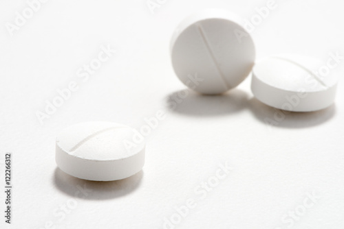 White tablet pills medication on white