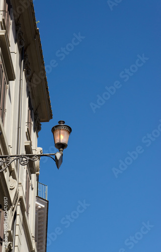 Old street lamp on blue sky with copy space