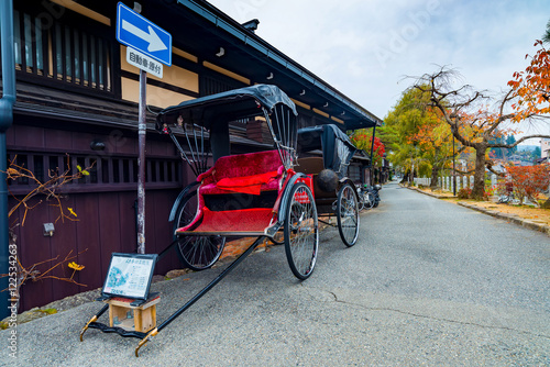 Japanese rickshaw or old style two wheeled passenger cart in Tak