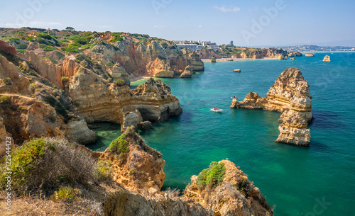 Scenic golden cliffs and emerald water in Ponta da Piedade, Lagos, Algarve, Portugal