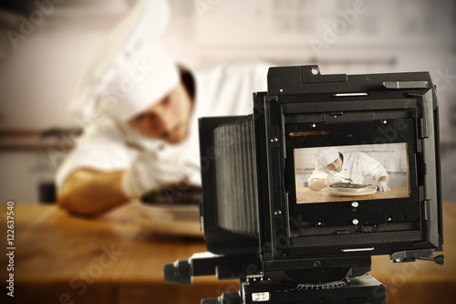 camera and cook in kitchen 