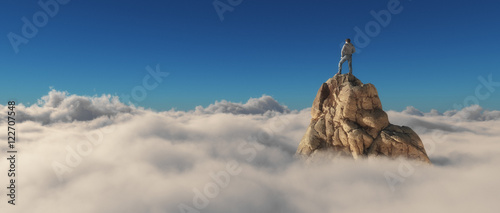 A man standing on a stone cliff