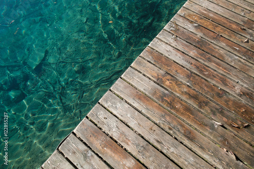 Wooden pier at a lake in the alps