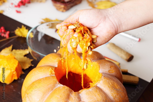 Carving out a pumpkin to prepare halloween lantern