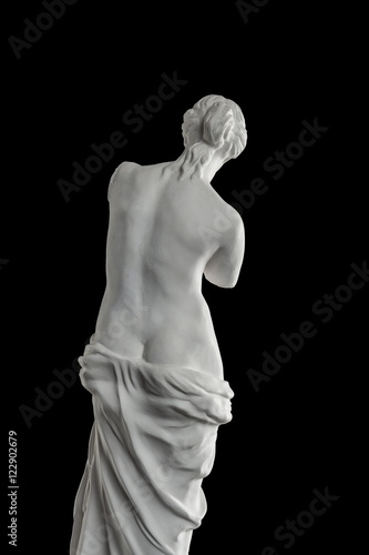 a statue of Venus, plaster column on a black background