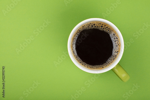 Americano black coffee in full big cup on green