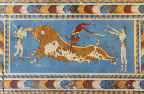 Famous a bull-leaping scene, two white-skined women and a brown-skined man from the Knossos Palace, 1600-1450 BC. Knossos is the largest archaeological site of Crete.