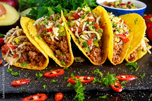 Mexican food - delicious taco shells with ground beef and home made salsa