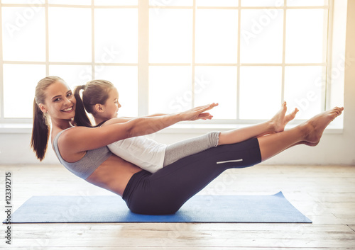 Mother and daughter doing yoga