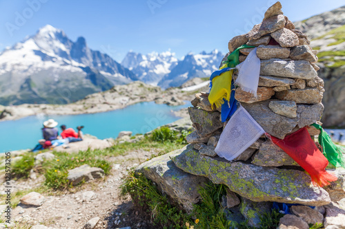 Prayer Flags on a Rock Pile Overlooking Lac Blanc in the Aguille Rouges area of the French Alps
