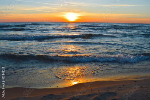 Brilliant sunrise over the waters of lake Huron in Oscoda, Michigan